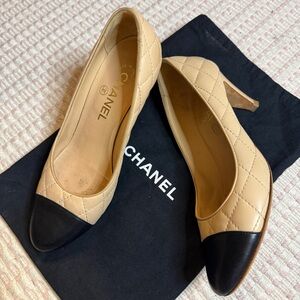 CHANEL Quilted Cap Toe CC Pumps in Beige & Black Leather